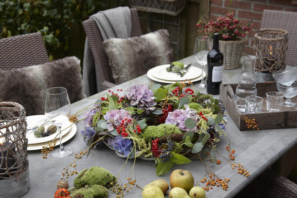 Autumn wreath on garden table