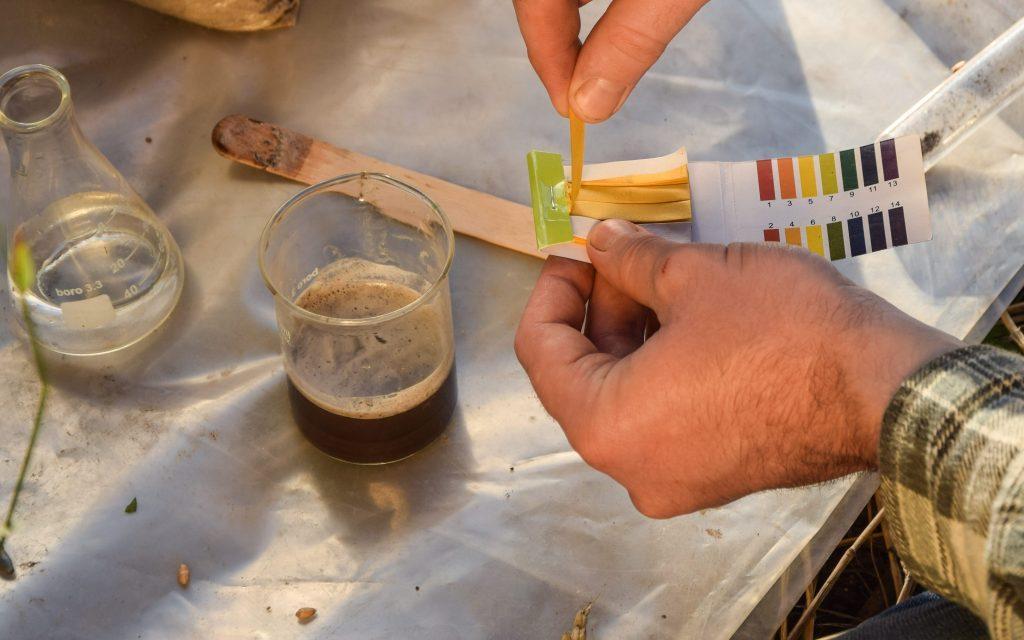 Closeup of testing soil sample ph value outdoors